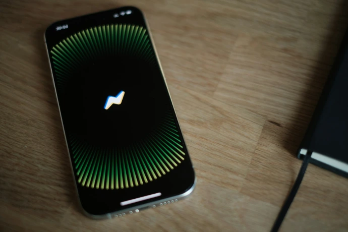 A close up of a cell phone on a table